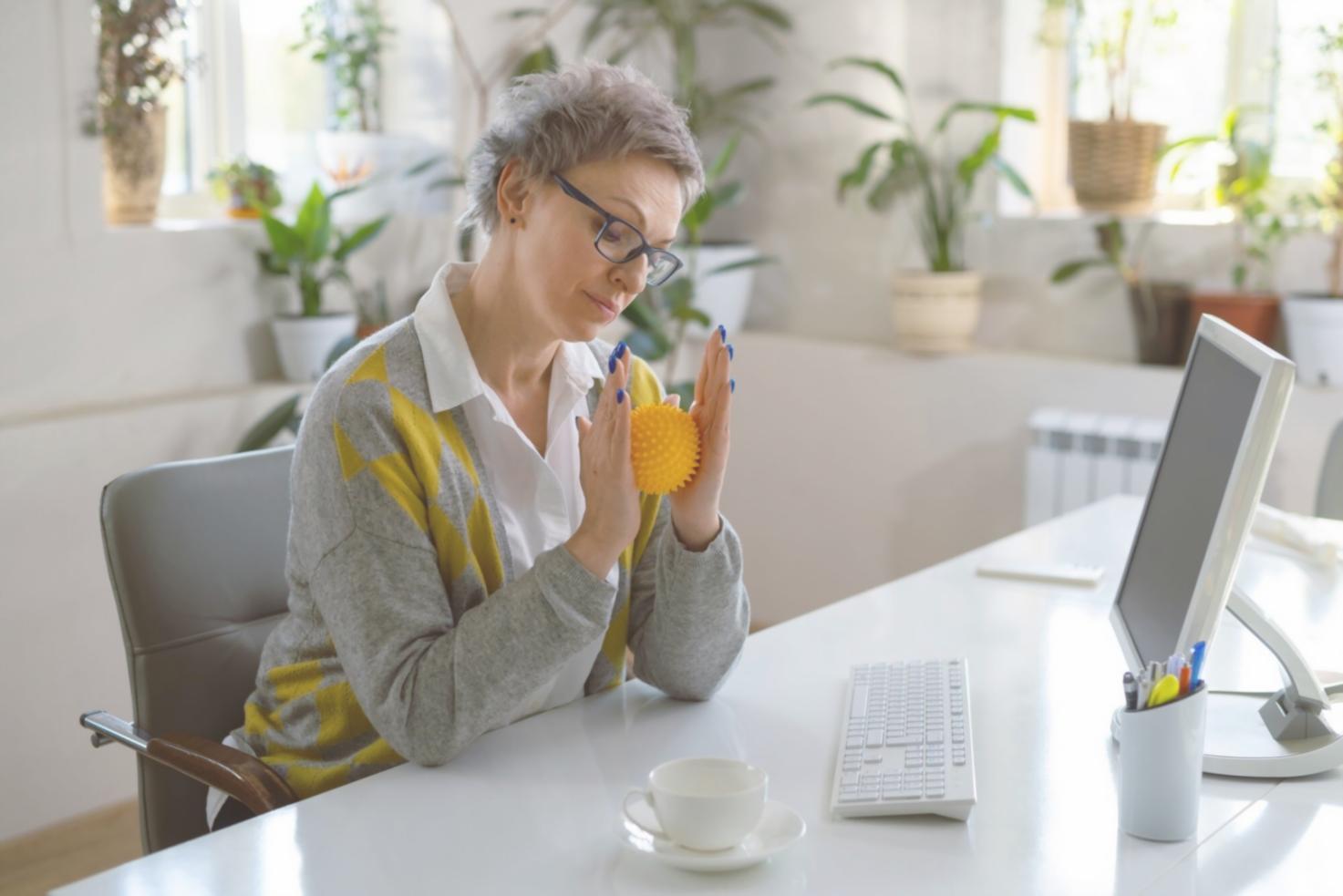 Business owner reviewing financial documents with coffee, showing organized approach to financial management